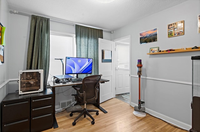 46324634 Cedar Ave S, Minneapolis, MN 55407 - office with a textured ceiling, wood finished floors, and visible vents