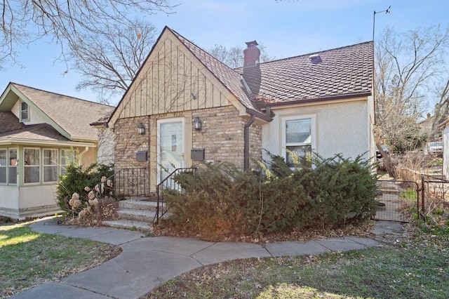 46324634 Cedar Ave S, Minneapolis, MN 55407 - view of front of house featuring fence, a chimney, and stucco siding