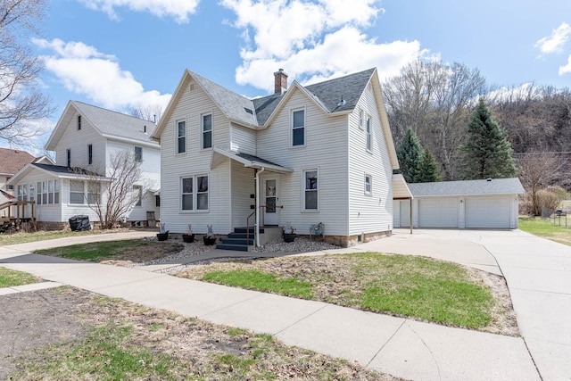 1509 5th St, Mankato, MN 56001 - traditional home featuring a garage, an outbuilding, a chimney, and roof with shingles