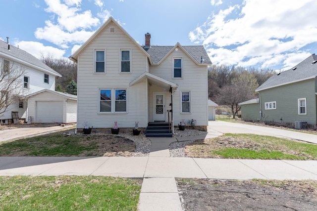 1509 5th St, Mankato, MN 56001 - traditional-style home featuring an outdoor structure, a chimney, and a garage