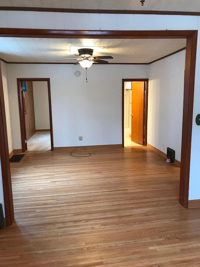 1509 5th St, Mankato, MN 56001 - unfurnished room featuring ceiling fan, baseboards, and light wood-style flooring