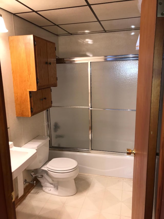 1509 5th St, Mankato, MN 56001 - full bathroom featuring combined bath / shower with glass door, toilet, a drop ceiling, and tile patterned floors