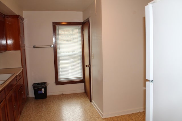 1509 5th St, Mankato, MN 56001 - bathroom with baseboards, a healthy amount of sunlight, and a sink