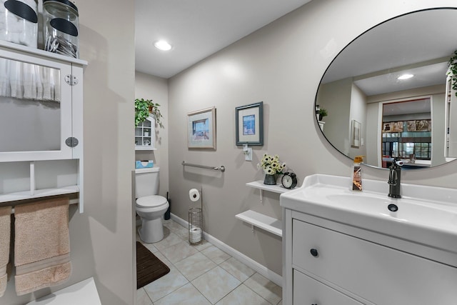 bathroom with tile patterned flooring, vanity, toilet, recessed lighting, and baseboards