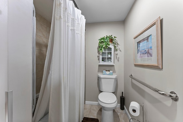 bathroom with baseboards, toilet, tile patterned floors, and curtained shower