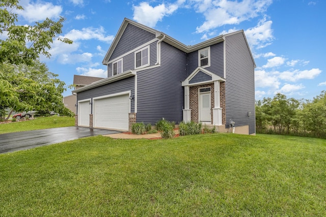 657 Golden Oak St NE, Lonsdale, MN 55046 - view of front facade with driveway, a front yard, an attached garage, and brick siding
