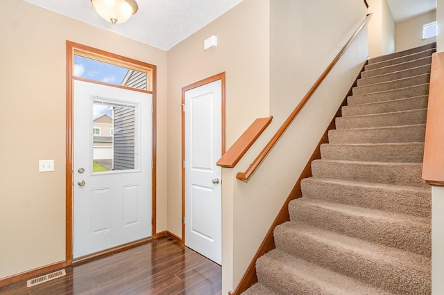 657 Golden Oak St NE, Lonsdale, MN 55046 - entrance foyer with dark wood-style floors and stairs