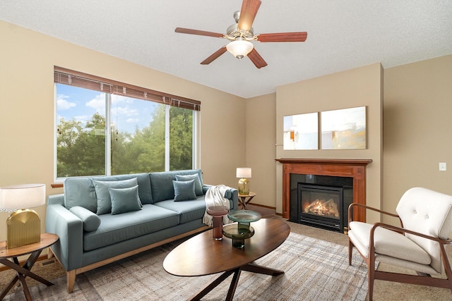 657 Golden Oak St NE, Lonsdale, MN 55046 - carpeted living area featuring a fireplace with flush hearth and ceiling fan