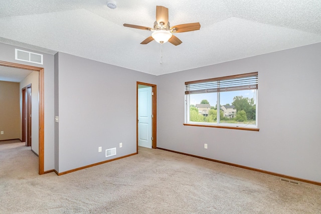 657 Golden Oak St NE, Lonsdale, MN 55046 - empty room featuring carpet flooring, a smoke detector, ceiling fan, and a textured ceiling