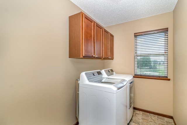 657 Golden Oak St NE, Lonsdale, MN 55046 - laundry area with washer and dryer, cabinet space, and light stone finish flooring