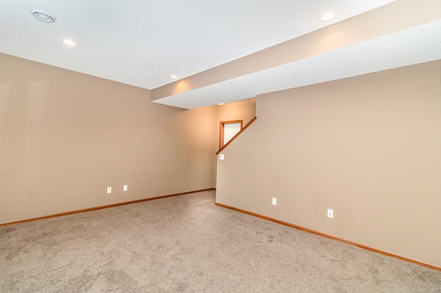 657 Golden Oak St NE, Lonsdale, MN 55046 - finished below grade area featuring carpet floors, recessed lighting, and stairway