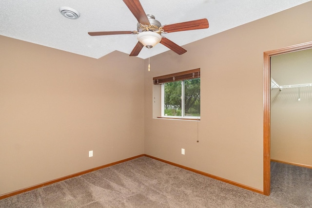 657 Golden Oak St NE, Lonsdale, MN 55046 - unfurnished bedroom featuring carpet, a spacious closet, a closet, and ceiling fan