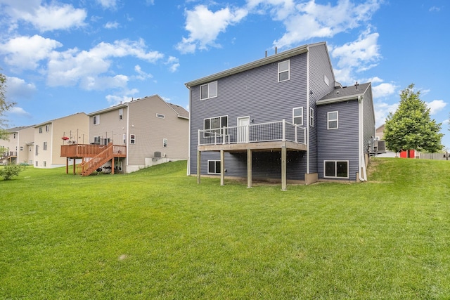 657 Golden Oak St NE, Lonsdale, MN 55046 - back of property featuring a wooden deck, a lawn, and stairway