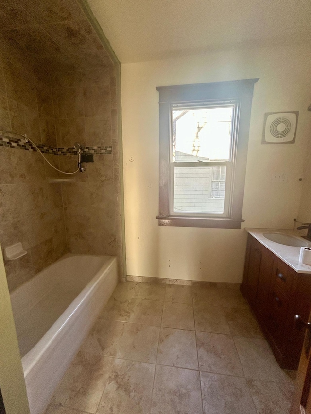 full bathroom with tile patterned floors and vanity