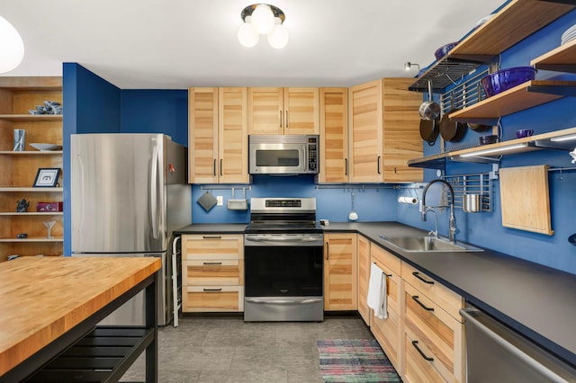 121 Washington Ave S Unit 1508, Minneapolis, MN 55401 - kitchen with appliances with stainless steel finishes, open shelves, a sink, and light brown cabinetry