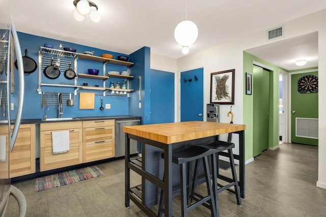 121 Washington Ave S Unit 1508, Minneapolis, MN 55401 - kitchen with a sink, light brown cabinetry, dishwasher, baseboards, and open shelves