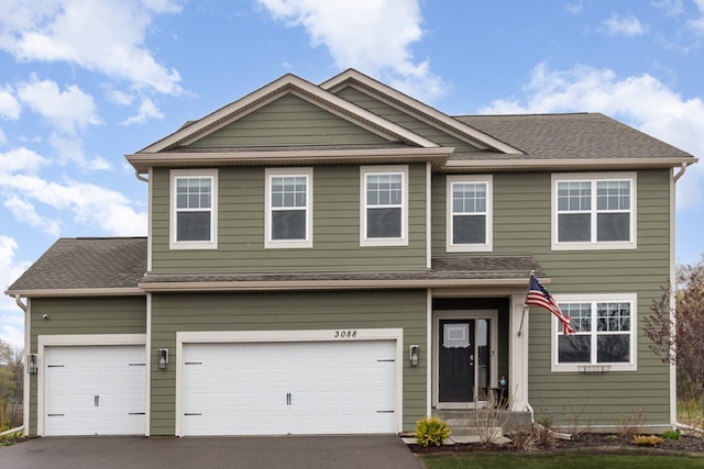 3088 Sunflower Way NW, Prior Lake, MN 55352 - view of front of house with driveway, a garage, and a shingled roof