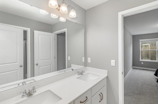 3088 Sunflower Way NW, Prior Lake, MN 55352 - bathroom featuring double vanity and baseboards