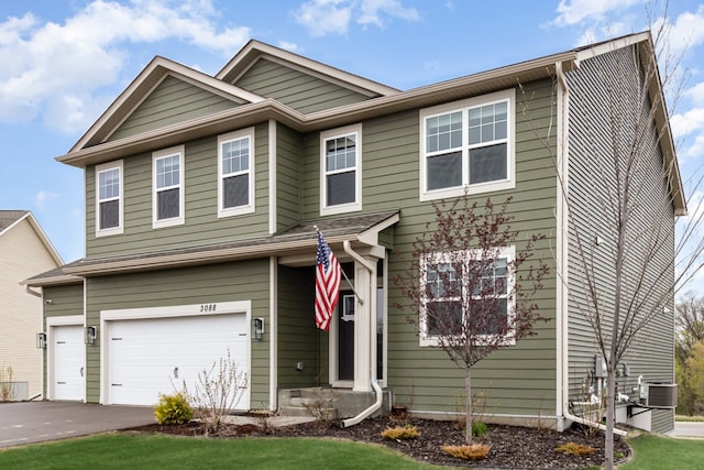 3088 Sunflower Way NW, Prior Lake, MN 55352 - view of front facade with an attached garage, asphalt driveway, a front lawn, and central air condition unit