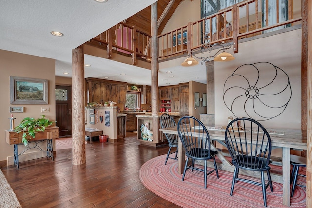 dining area featuring dark wood finished floors and recessed lighting