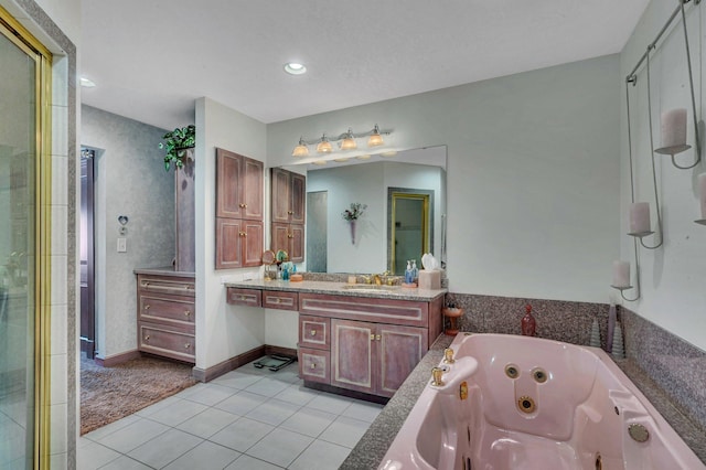 bathroom featuring tile patterned floors, baseboards, recessed lighting, a whirlpool tub, and vanity