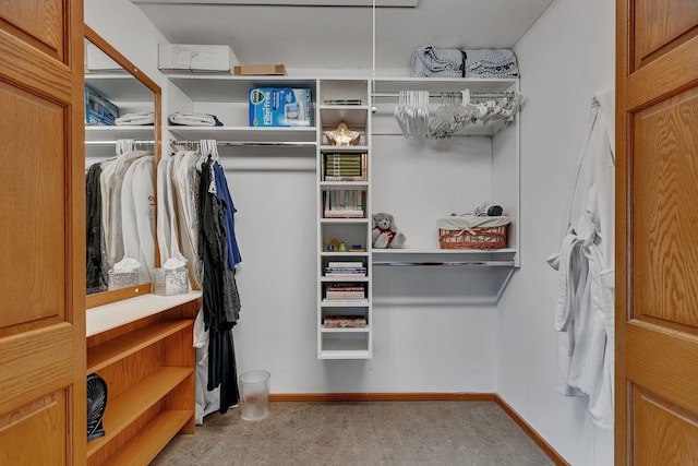 spacious closet with carpet flooring