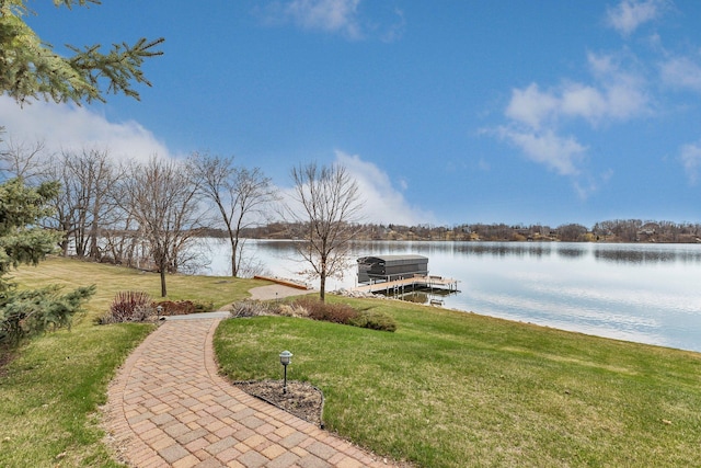 exterior space with a yard and a water view