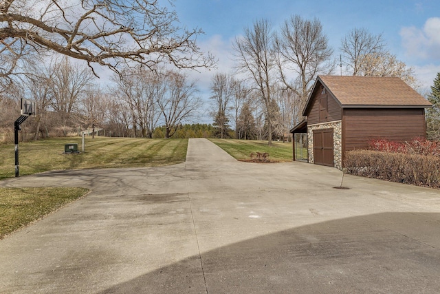 view of street with concrete driveway