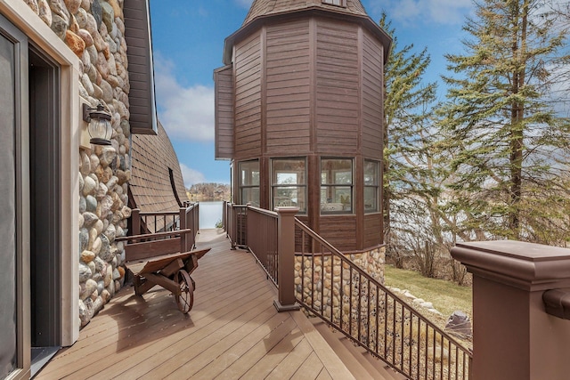 wooden deck featuring a water view