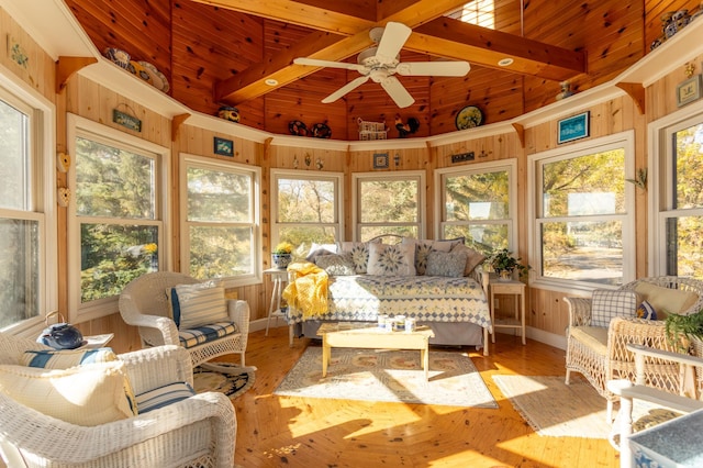 sunroom with beamed ceiling, an outdoor living space, and ceiling fan