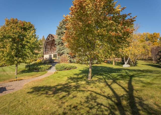 view of property's community with a lawn