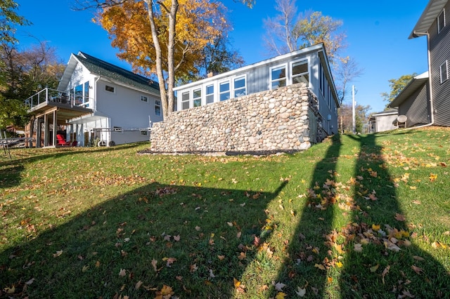 884 White Clover Beach Rd, Detroit Lakes, MN 56501 - rear view of property with a lawn, a deck, and a chimney