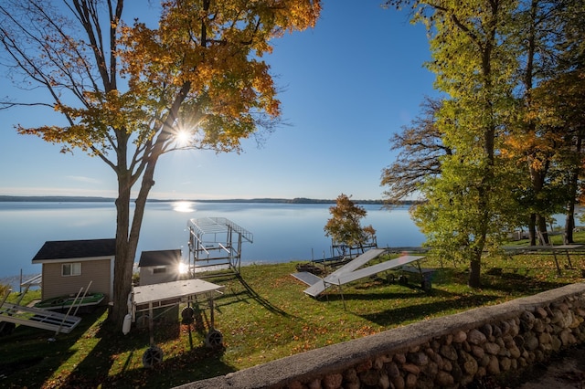 884 White Clover Beach Rd, Detroit Lakes, MN 56501 - dock area featuring a lawn and a water view