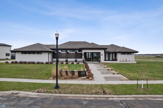 505 Tessa Dr, Moorhead, MN 56560 - prairie-style home featuring brick siding and a front lawn