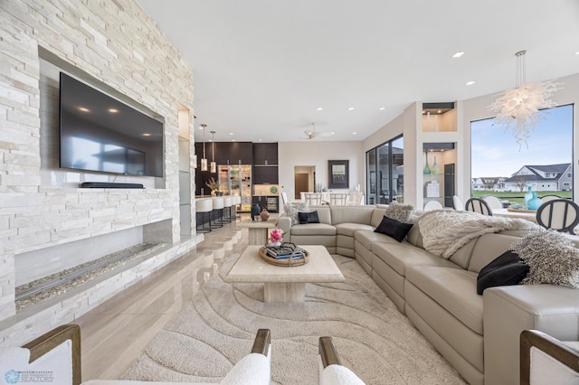 505 Tessa Dr, Moorhead, MN 56560 - tiled living area with a fireplace and recessed lighting