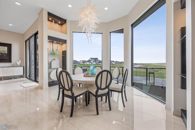 505 Tessa Dr, Moorhead, MN 56560 - dining room featuring a chandelier and recessed lighting