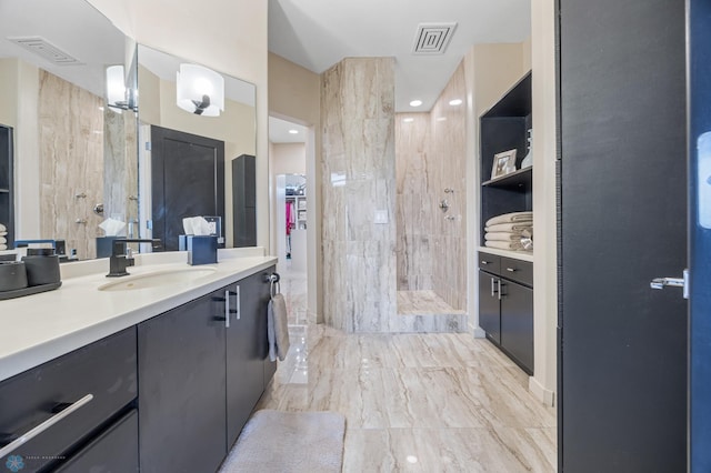 505 Tessa Dr, Moorhead, MN 56560 - full bathroom featuring marble finish floor, walk in shower, vanity, and visible vents