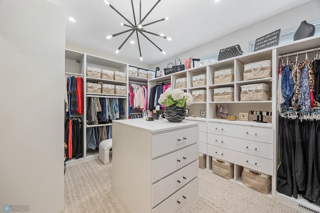 505 Tessa Dr, Moorhead, MN 56560 - walk in closet with an inviting chandelier, light colored carpet, and visible vents