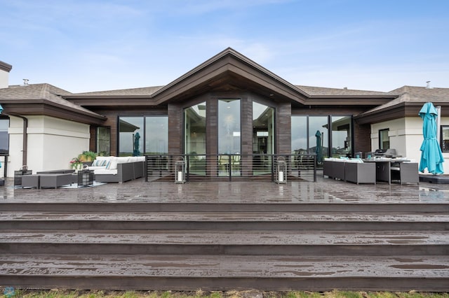 505 Tessa Dr, Moorhead, MN 56560 - back of property featuring a deck, a shingled roof, and outdoor lounge area