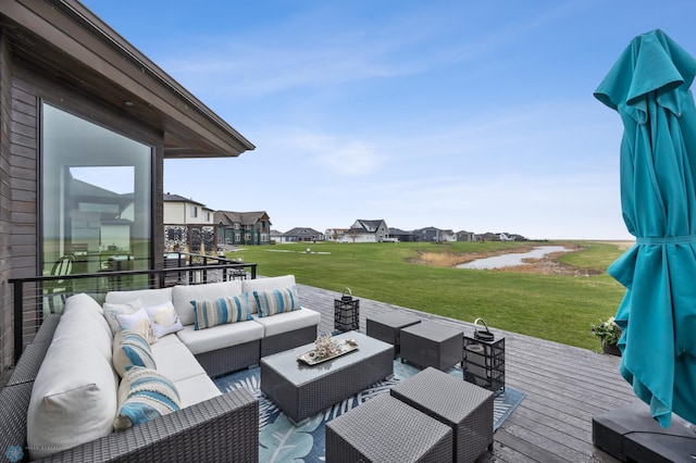 505 Tessa Dr, Moorhead, MN 56560 - wooden terrace with an outdoor living space, a water view, a residential view, and a lawn