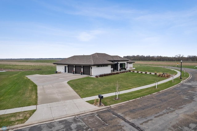 505 Tessa Dr, Moorhead, MN 56560 - prairie-style house featuring roof with shingles, an attached garage, a front lawn, and driveway