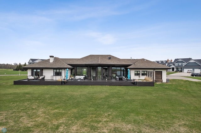 505 Tessa Dr, Moorhead, MN 56560 - back of house featuring a sunroom, a yard, and roof with shingles