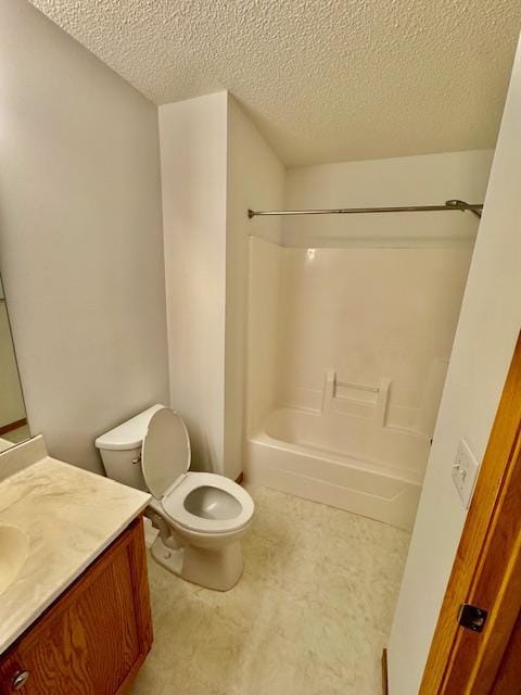 full bathroom featuring toilet, vanity, a textured ceiling, and shower / bath combination