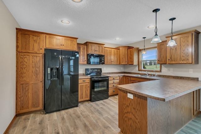 103 Grandview Ct, Buffalo, MN 55313 - kitchen with black appliances, a sink, a peninsula, brown cabinetry, and pendant lighting