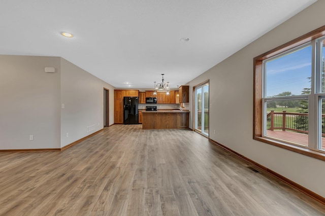 103 Grandview Ct, Buffalo, MN 55313 - unfurnished living room with a chandelier, light wood finished floors, baseboards, and recessed lighting