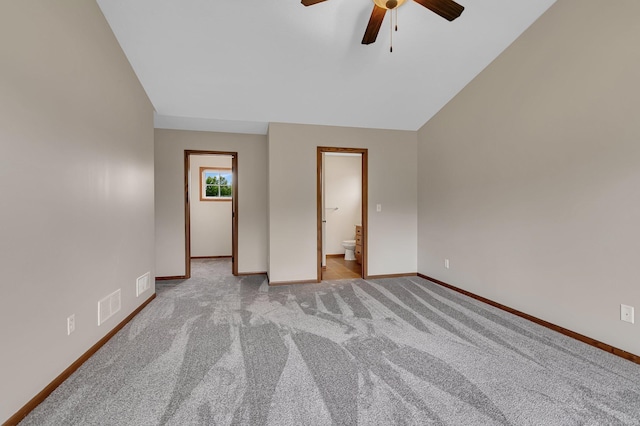 103 Grandview Ct, Buffalo, MN 55313 - unfurnished bedroom featuring baseboards, carpet floors, lofted ceiling, ensuite bathroom, and a ceiling fan