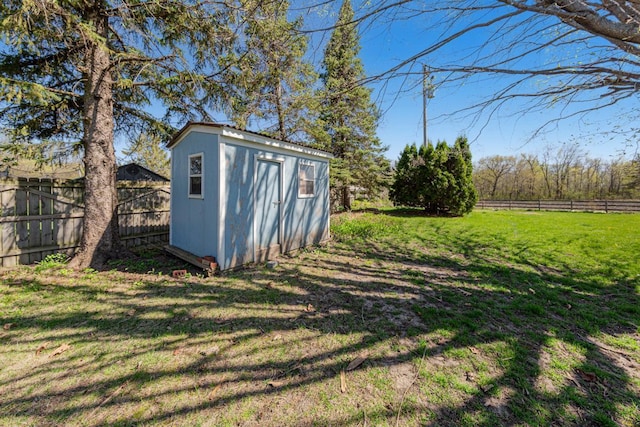 view of shed featuring a fenced backyard