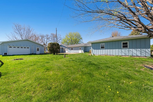 view of yard with an outbuilding and a garage