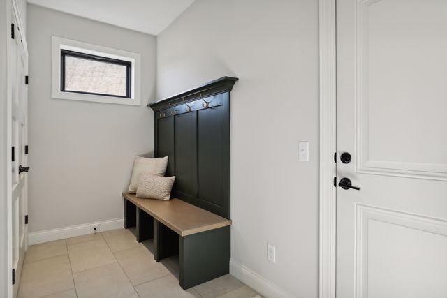 4029 Arbor Dr, Woodbury, MN 55129 - mudroom featuring baseboards and light tile patterned floors