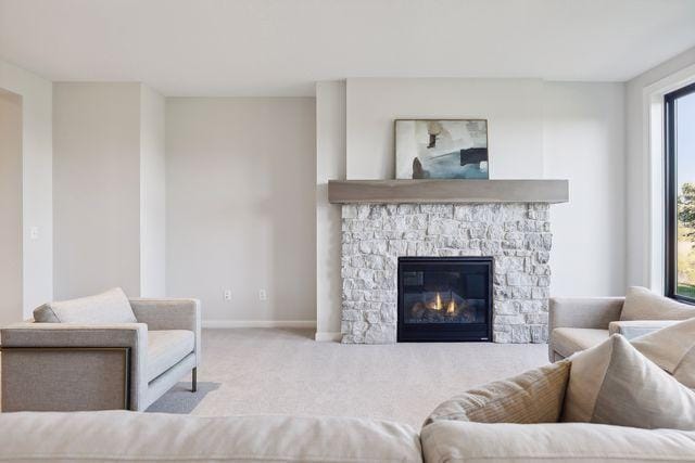 4029 Arbor Dr, Woodbury, MN 55129 - living area featuring baseboards, carpet, and a fireplace